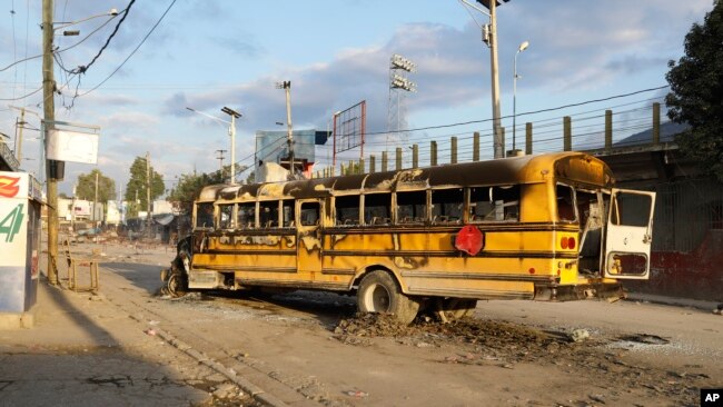 A bus set on fire by gang members in Port-au-Prince, Haiti, Feb. 29, 2024. Gunmen shot at the international airport and other targets in a wave of violence that forced businesses, government agencies and schools to close early.