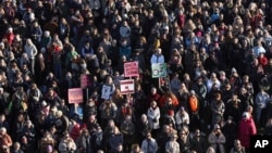 People across Iceland gather during the women's strike in Reykjavik, Iceland, Tuesday, Oct. 24, 2023. (AP Photo/Arni Torfason)