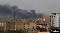 Smoke rises from the tarmac of Khartoum International Airport as a fire burns, in Khartoum, Sudan April 17, 2023, in this screen grab obtained from a social media video.