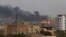 Smoke rises from the tarmac of Khartoum International Airport as a fire burns, in Khartoum, Sudan April 17, 2023, in this screen grab obtained from a social media video.