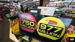 A Pennsylvania Lottery kiosk in Erie, Pennsylvania, announces the top prizes as of March 22, 2024. The Mega Millions jackpot has since climbed to an estimated $1.1 billion after no one matched the game's six numbers Friday night.