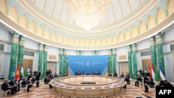 In this handout photograph released by Kazakhstan's presidential press service, Kazakhstan's President Kassym-Jomart Tokayev, center, speaks at a Heads of State of Central Asia Summit session in Astana on Aug. 9, 2024. 