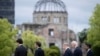 Leaders of the Group of Seven nations' meetings walk before the Atomic Bomb Dome, during a visit to the Peace Memorial Park as part of the G7 Leaders' Summit in Hiroshima, Japan, May 19, 2023.