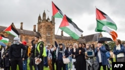 Members of the Australian Palestinian community shout slogans at the Palestinian Protest Campsite at University of Sydney in Sydney on May 3, 2024.