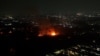 Tangkapan layar video udara yang diperoleh dari Fritz Markus yang diambil pada 30 Maret 2024 ini menunjukkan yang membakar gudang amunisi militer di Bogor, Jawa Barat. (Foto: Fritz Markus/UGC/AFP)