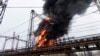 Api dan asap mengepul dari kobaran api di sebuah pembangkit listrik setelah serangan Rusia di Kharkiv, Ukraina, Jumat 22 Maret 2024. (Foto: AP)