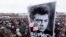 FILE - People gather in memory of opposition leader Boris Nemtsov in St. Petersburg, Russia, on Feb. 26, 2017. Once deputy prime minister, Nemtsov was a popular politician and harsh critic of Vladimir Putin. He was gunned down by assailants on a bridge near the Kremlin in 2015.