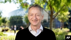 FILE - Computer scientist Geoffrey Hinton, who studies neural networks used in artificial intelligence applications, poses at Google's Mountain View, Calif, headquarters on Wednesday, March 25, 2015. (AP Photo/Noah Berger)