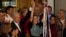 Mexican President Andres Manuel Lopez Obrador raises the hand of Claudia Sheinbaum, the ruling party's candidate for the upcoming presidential elections, during a ceremony to giver her the party's command staff, in Mexico City, Sept. 7, 2023.
