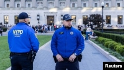 New York police officers stand guard as pro-Israel and pro-Palestinian students demonstrate at Columbia University in New York City on Oct. 12, 2023.