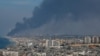 Smoke rises from the Israeli side after Palestinian Hamas gunmen infiltrated areas of southern Israel, as seen from Gaza, Oct. 7, 2023. 