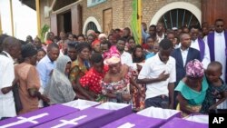 People view the bodies of people killed following an attack by a rebel group based in the neighboring Democratic Republic of Congo on Friday, at the St François Xavier parish church, in Gatumba, Burundi on Tuesday, December 26, 2023.