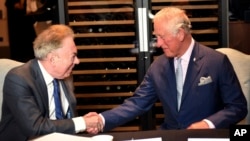FILE - Britain's Prince Charles meets Andrew Lloyd Webber during a visit to the Royal Albert Hall to discuss the arts and creativity in school, in London, Sept. 5, 2018. Webber has written the anthem for King Charles III’s coronation.
