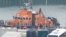 FILE - People believed to be migrants disembark a Royal National Lifeboat Institution lifeboat after being rescued from the English Channel while crossing from France, in Dover, Britain, Dec. 17, 2022. 