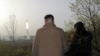 김정은(왼쪽) 북한 국무위원장이 13일 고체연료 기반 신형 대륙간 탄도미사일(ICBM) '화성포-18'형 시험발사를 참관하고 있다. 조선중앙통신이 다음날(14일) 공개한 사진.