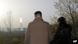 This photo provided April 14, 2023, by the North Korean government shows North Korean leader Kim Jong Un watching what it says is the test-launch of Hwasong-18 intercontinental ballistic missile April 13, 2023, at an undisclosed location.