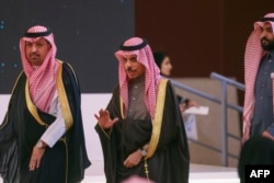 Saudi Arabia's Foreign Minister Faisal bin Farhan, center, arrives to attend the 3rd Riyadh International Humanitarian Forum in Riyadh, Feb. 20, 2023.