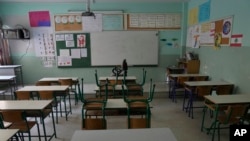 An empty classroom in a closed public school is seen in Beirut, Lebanon, March 2, 2023. Public schools have been open for fewer than 50 days this school year because teachers are on strike.