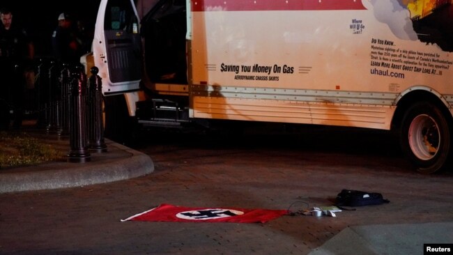 A Nazi flag and other objects recovered from a rented box truck are pictured as the U.S. Secret Service and other law enforcement agencies investigate the truck that crashed into security barriers at Lafayette Park across from the White House in Washington, May 23, 2023.