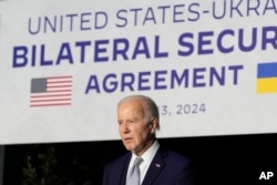 US President Joe Biden listens to a question during a news conference after signing a bilateral security agreement with Ukraine's President Volodymyr Zelenskyy during the sidelines of the G7 summit at Savelletri, Italy, June 13, 2024.