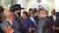 FILE - South Sudanese President Salva Kiir Mayardit, left, shakes hands with Pagan Amum Okiech of the Real-SPLM group during peace talks in Nairobi, Kenya, on May 9, 2024. 