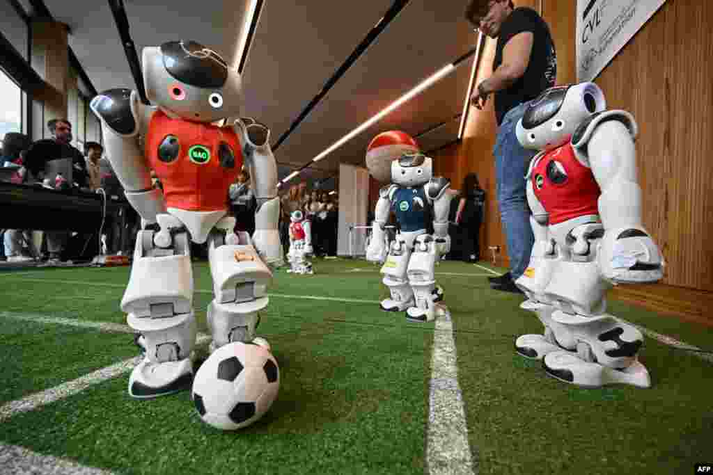 Robots of the Zurich Federal Institute of Technology play a football game during the International Telecommunication Union (ITU) AI for Good Global Summit in Geneva.
