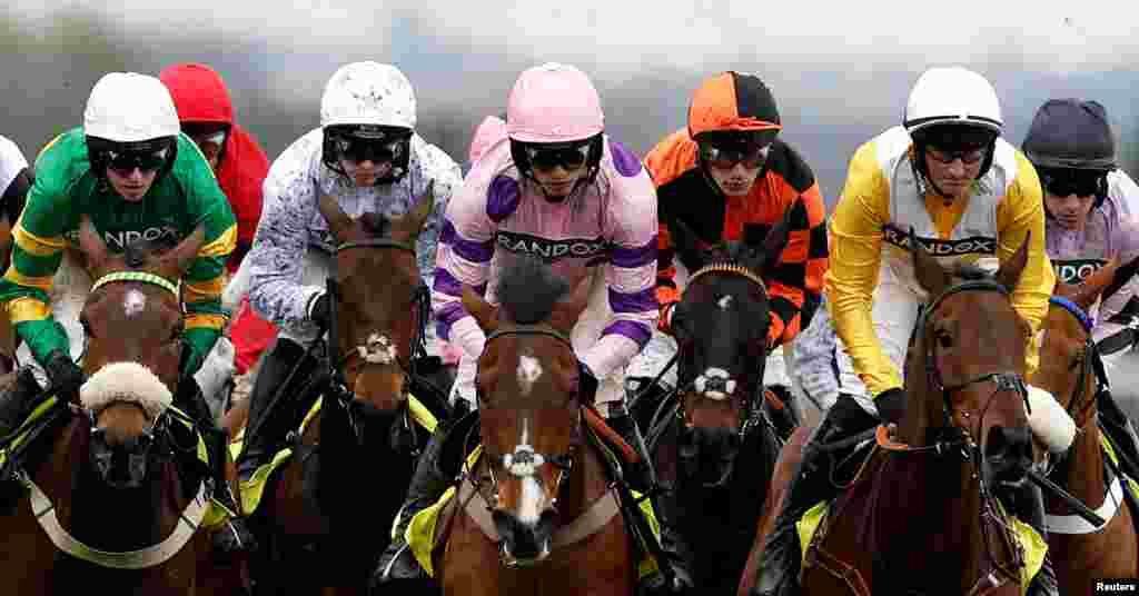 Riders are seen on the second day of the Grand National Festival horse race meeting at Aintree Racecourse in Liverpool, north-west England.