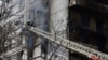 Firefighters put out fire after a Russian missile hit a residential multi-story building in southeastern city of Zaporizhzhia, Ukraine, March 22, 2023.