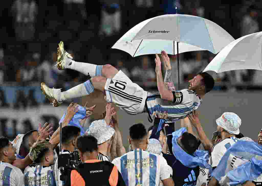 Argentina&#39;s forward Lionel Messi is lifted up by teammates during a recognition ceremony for the World Cup winning players, following the friendly football match between Argentina and Panama at the Monumental stadium in Buenos Aires, where Messi scored the 800th goal of his career, on March 23, 2023.