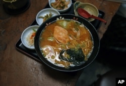 FILE - A traditional Japanese meal being served at a Denver restaurant.