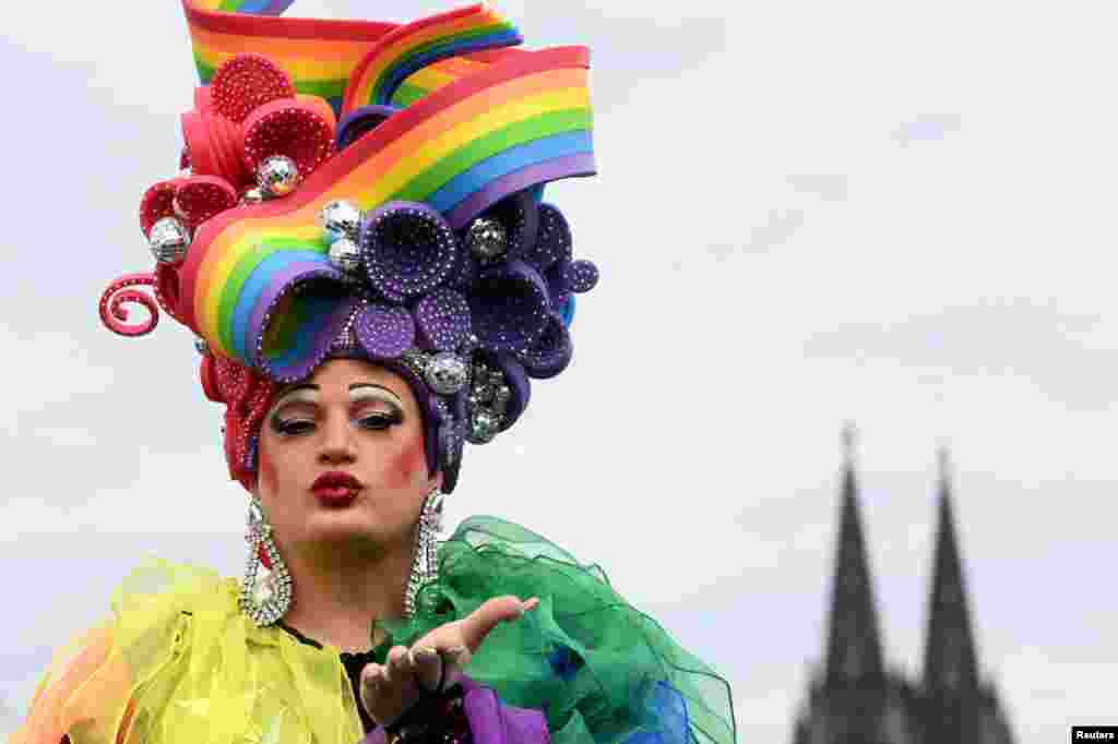 A participant poses on the day people from LGBTQ+ community and their allies parade the city to claim visibility and equal rights, in Cologne, Germany, July 21, 2024. 