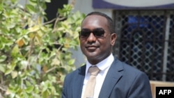 FILE: Abdalle Ahmed Mumin poses outside the Banadir regional court headquarters in Mogadishu. Taken Jan. 4, 2023.