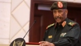 FILE - Sudan's Army chief Abdel Fattah al-Burhan speaks following the signing of an initial deal aimed at ending a deep crisis caused by last year's military coup, in the capital Khartoum on December 5, 2022.