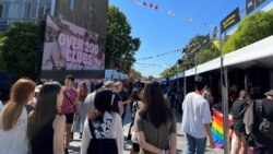 FILE - Students walk past stalls during the orientation week at The University of Sydney, in Camperdown, Australia February 15, 2023. (REUTERS/ Stella Qiu/File Photo)