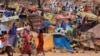 FILE - Sudanese refugees who fled the conflict in Sudan's Darfur region are seen in a makeshift camp near the border between Sudan and Chad, in Borota, Chad, May 13, 2023.