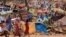 FILE - Sudanese refugees who fled the conflict in Sudan's Darfur region are seen in a makeshift camp near the border between Sudan and Chad, in Borota, Chad, May 13, 2023.