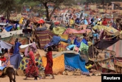 FILE - Sudanese refugees who fled the conflict in Sudan's Darfur region are seen in a makeshift camp near the border between Sudan and Chad, May 13, 2023.