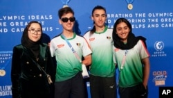 Afghanistan athletes from left to right, Zakia Khudadi, Fariba Hahimi, Yuldoz Hashimi and Kimia Yousofi arrive for the Sport for Peace Gala in Paris, Aug. 3, 2024.