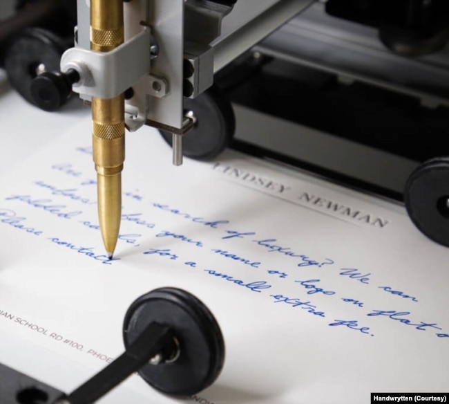 A robotic arm created by the Handwrytten company writes a "personalized" letter for a business that wants to foster better communication with its customers. (Courtesy photo)