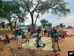 FILE - Sudanese refugees who fled the conflict in Sudan gather on July 10, 2023, at the Zabout refugee camp in Goz Beida, Chad. Some 260,000 people have fled Darfur into neighboring Chad after fighters and militias stormed a number of cities and towns, burning houses and driving out residents.