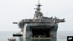 FILE - The USS Essex ports at the Gulf of Thailand near Cambodia's port town of Sihanoukville, 20 kilometers southwest of Phnom Penh, Cambodia, Nov. 26, 2007.