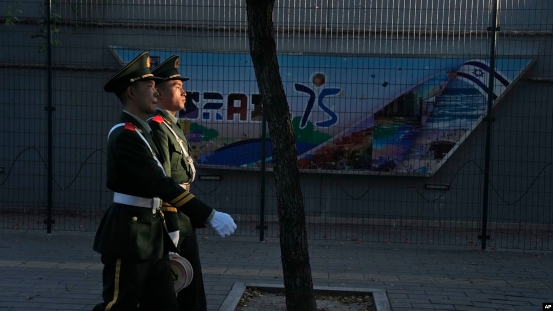 Chinese paramilitary policemen patrol outside the Israeli Embassy in Beijing, Oct. 13, 2023. 