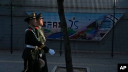 Chinese paramilitary policemen patrol outside the Israeli Embassy in Beijing, Oct. 13, 2023. 