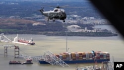 President Joe Biden, aboard Marine One, takes an aerial tour of the collapsed Francis Scott Key Bridge in Baltimore, Maryland, April 5, 2024.