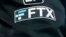 FILE - The FTX logo appears on home plate umpire Jansen Visconti's jacket at a baseball game with the Minnesota Twins on Sept. 27, 2022, in Minneapolis. 