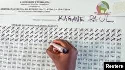 A worker from the National Electoral Commission (NEC) tallies casted ballots in favor of the Rwanda's incumbent President Paul Kagame at the G.S. Kagugu polling center in Kinyinya, Gasabo district of Kigali, July 15, 2024.