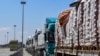 Egyptian trucks carrying humanitarian aid bound for the Gaza Strip queue outside the Rafah border crossing on the Egyptian side on March 23, 2024. UN secretary-general says it is 'moral outrage' that aid is being blocked from being sent into Gaza.