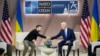 President Joe Biden, right, shakes the hand of Ukraine's President Volodymyr Zelenskyy during a meeting on the sidelines of the NATO Summit in Washington, July 11, 2024. 