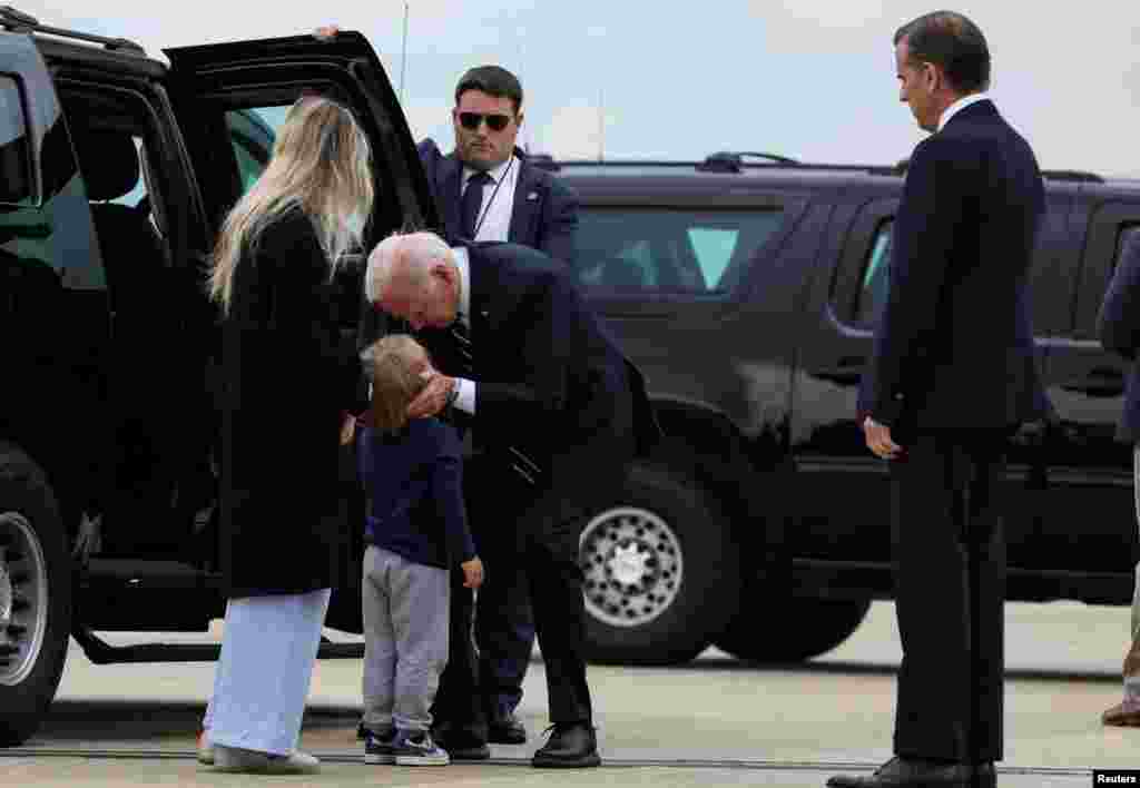 U.S. President Joe Biden embraces his grandson, Beau Biden, as his daughter-in-law Melissa Cohen Biden and his son Hunter Biden look on after the President arrived at the Delaware Air National Guard Base in New Castle, Delaware, June 11, 2024.