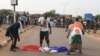 FILE - Protesters defile a French national flag during a rally in Niamey, Niger, Sept. 1, 2023, demanding the departure of French troops from Niger.